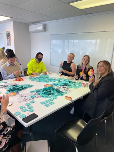 Perceptive team members packing condoms for the NZ Aids Foundation